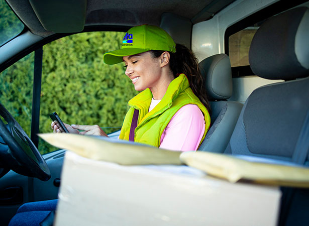 delivery driver sitting with packages